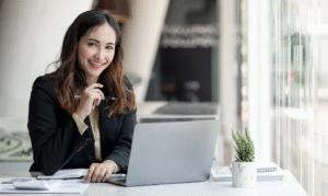 University staff using Salesforce-native event management software on laptop