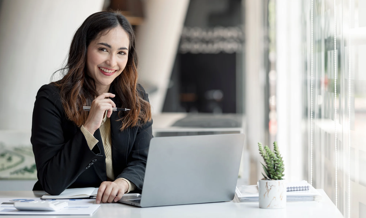 University staff using Salesforce-native event management software on laptop