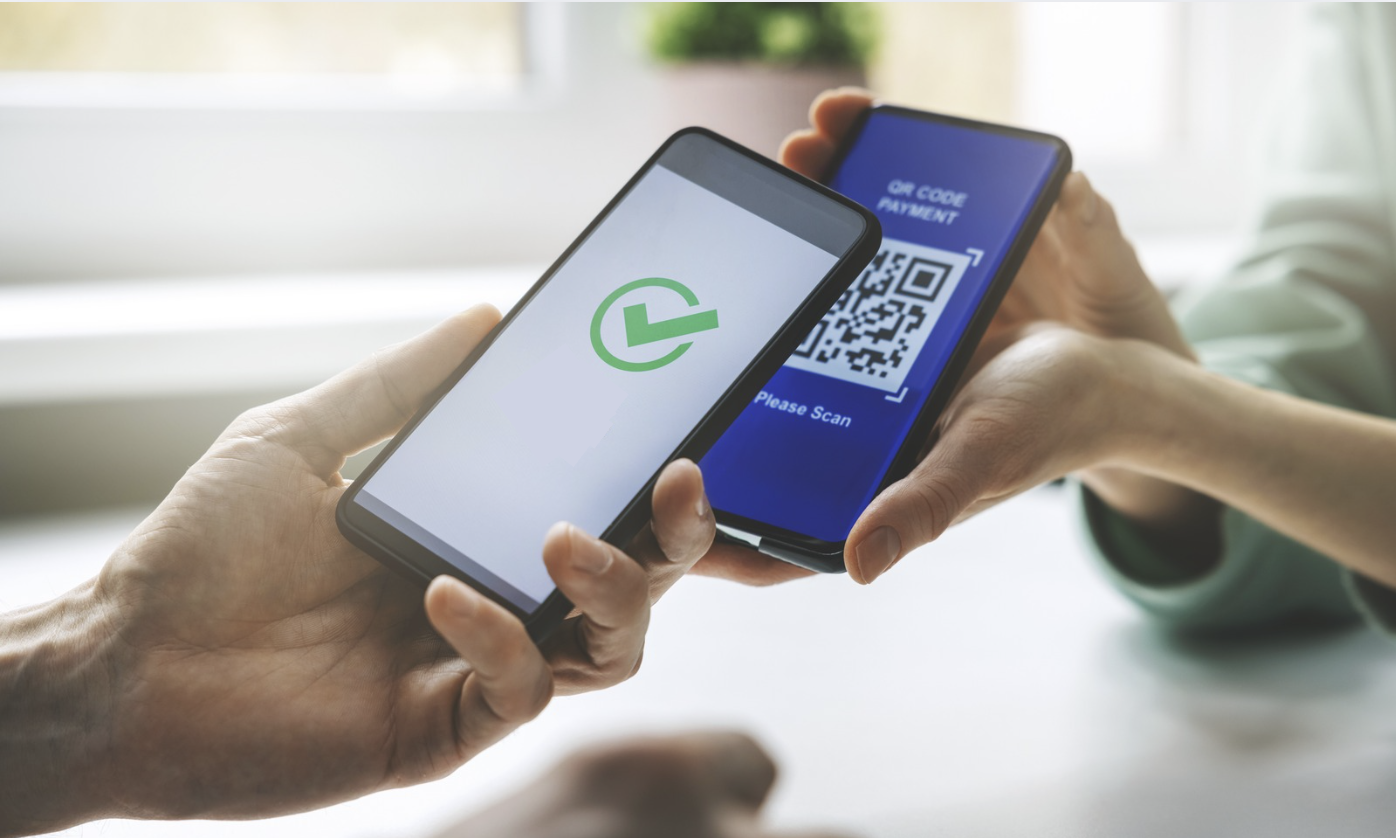 QR Codes in Event Check-Ins 1 Event staff scanning attendee QR codes with a mobile device for fast, seamless event check-in in Salesforce